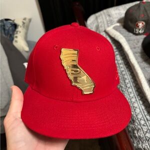 Red and gold new era fitted size 7 gold plate ca logo